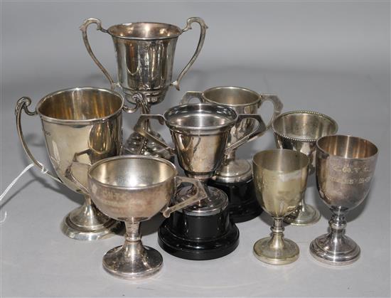 Two silver miniature trophy cups and some plated ware